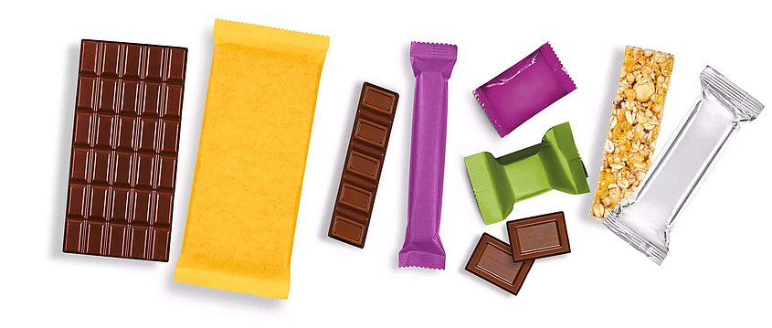 Different confectionery products in colorful packaging